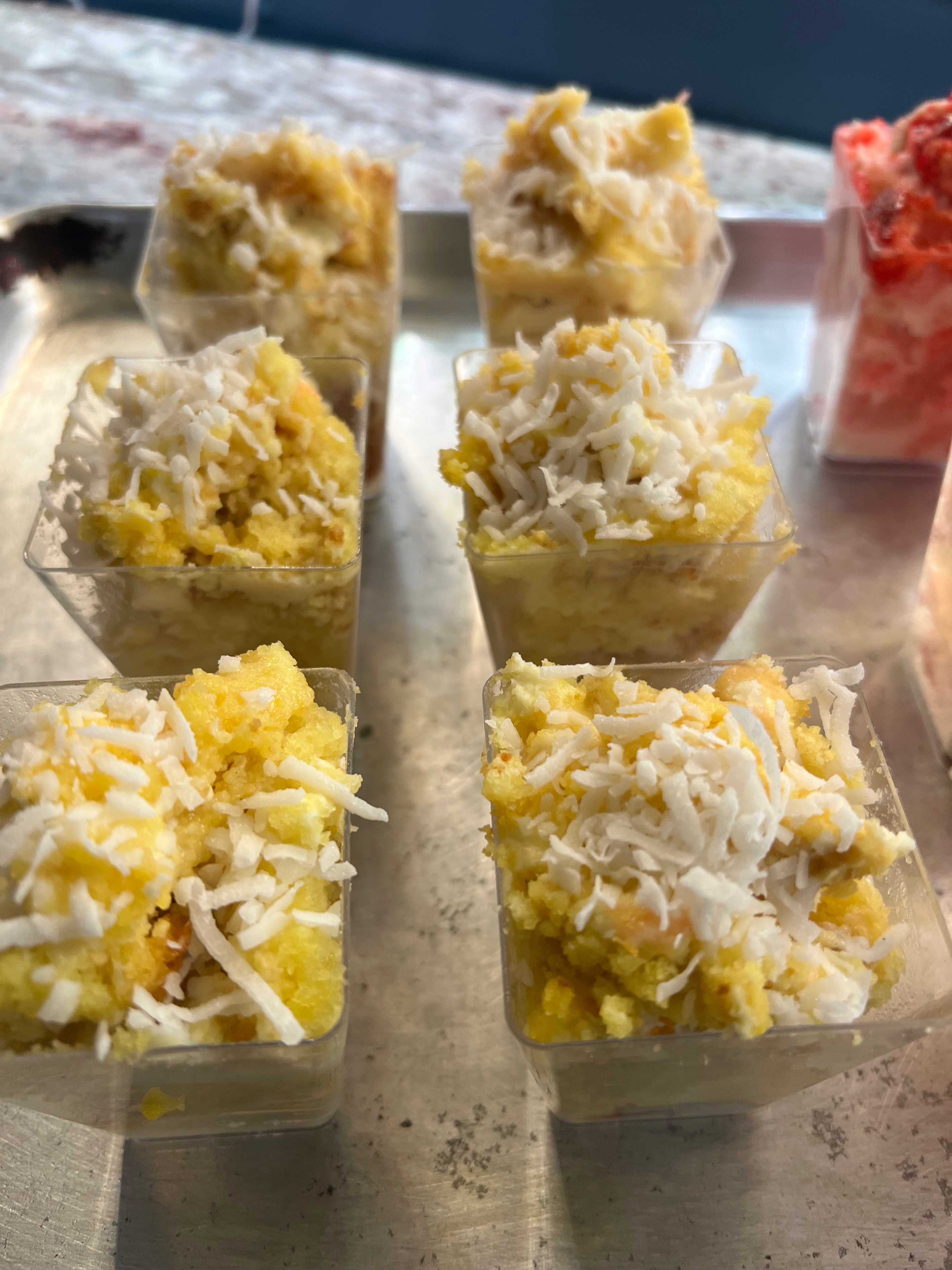 Coconut cake squares in individual clear cups — Dr. Bea signature dessert